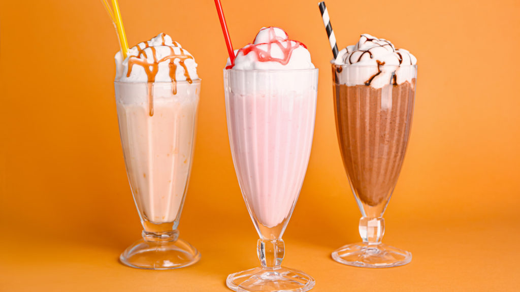 Assortment of different flavor milkshakes